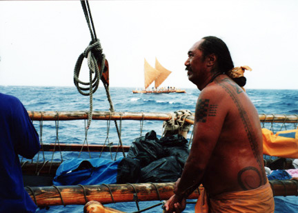 A photo of Clement Tiger Espere steering the Hōkūle‘a, used for the Nā ‘Aumākua Project